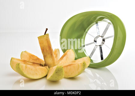 apple cut into wedges in front Stock Photo