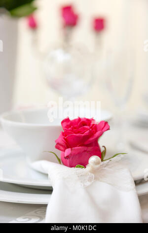 set up of a wedding table decorated with flowers Stock Photo