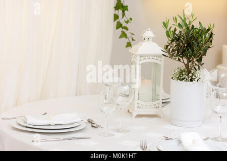 set up of a wedding table decorated with flowers Stock Photo
