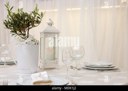 set up of a wedding table decorated with flowers Stock Photo