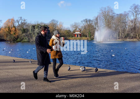 Young couple in Victoria Park during winter, London England United Kingdom UK Stock Photo