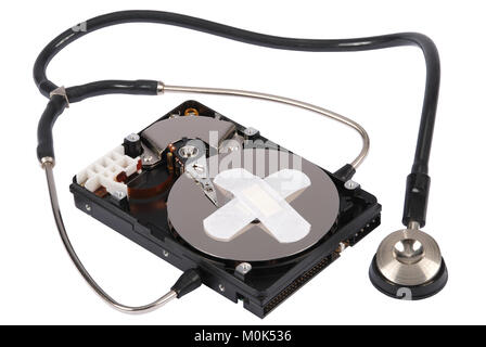 Destroying data from hard disk - conceptual photo. Hard drives and Stethoscope. On white background Stock Photo