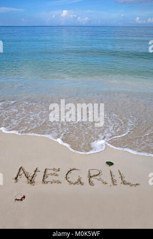 The word Negril written on the sand by the ocean Stock Photo