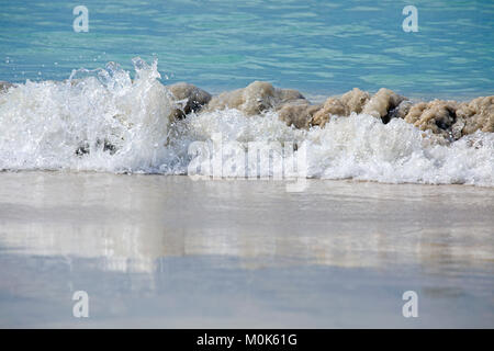 Sea wave closeup with water reflection on the wet sand Stock Photo