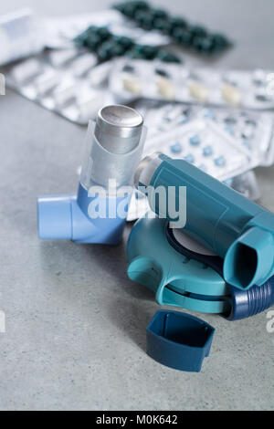 Pills and inhalers for asthma, bronchitis, lungs diseases, first aid Stock Photo