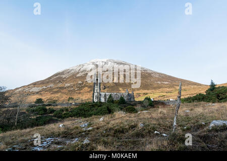 This is the Ruins of Dunlewey Church in front of Mount Errigal Stock Photo