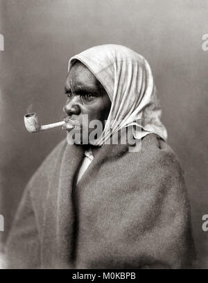 Aboriginal woman smoking a pipe, Australia, c.1890 Stock Photo