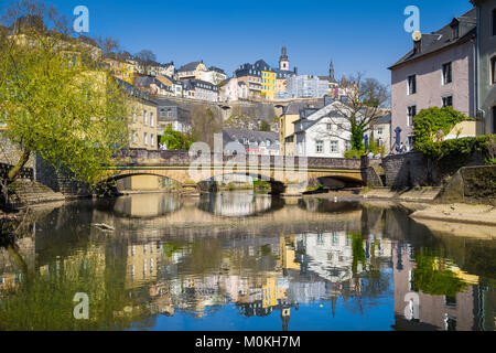 Classic view of the famous old town of Luxembourg City reflecting in idyllic Alzette river on a beautiful sunny day with blue sky in springtime Stock Photo