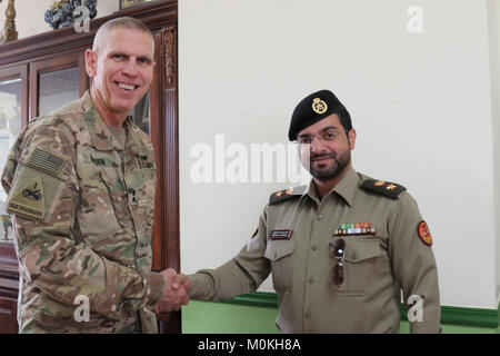 The 35th Infantry Division hosts a luncheon at the Oasis dining facility with the Kuwait Armed Forces Military Justice Authority Jan. 17. The legal teams met to discuss legal cooperation between the two countries and building a lasting partnership for the future. Maj. Gen. Victor Braden presents a 35th Inf. Div. coin to Lt. Col. Qunais Al Adwani. (U.S. Army Stock Photo