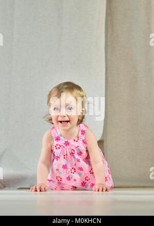 Happy little girls in pink on bright  background Stock Photo