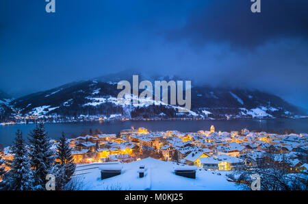 Panoramic view of Zell am See with Zeller See lake in twilight during blue hour at dusk in winter, Salzburger Land, Austria Stock Photo