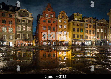 Classic view of famous Stortorget town square in historic Gamla Stan (Old Town) in central Stockholm illuminated at night with reflections, Sweden Stock Photo