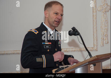 Col. Kenneth Cole, the 12th Combat Aviation Brigade (CAB) Commander,  makes remarks in honor of Chief Warrant Officer 4, Brian K. Calhoun, during his retirement ceremony at Katterbach Army Airfield in Ansbach, Bavaria, Germany, Jan. 5, 2018. (U.S. Army Stock Photo