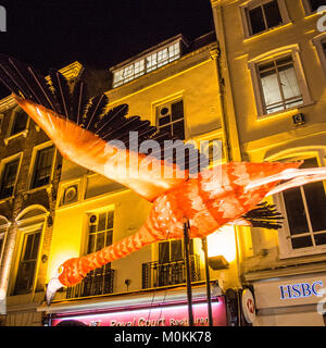 'Flying' Flamingo operated by puppeteers in Chinatown during the 'Lumiere' Light Festival, London. Stock Photo