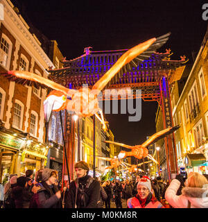 'Flying' Flamingo's operated by puppeteers in Chinatown during the 'Lumiere' Light Festival, London. Stock Photo