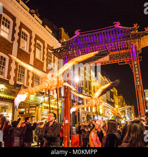 'Flying' Flamingo's operated by puppeteers in Chinatown during the 'Lumiere' Light Festival, London. Stock Photo