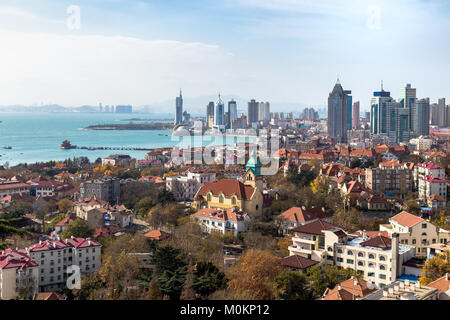 Qingdao Bay and the Lutheran church seen from the hill of Signal Park in Autumn, Qingdao, China Stock Photo