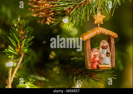 Christmas decoration on a Christmas tree with lights and copy space. Stock Photo
