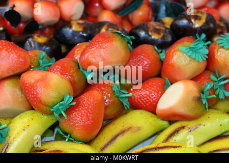 typical sicilian  marzipan pastries in shape of various colored  fruits also known as  frutta martorana. Stock Photo
