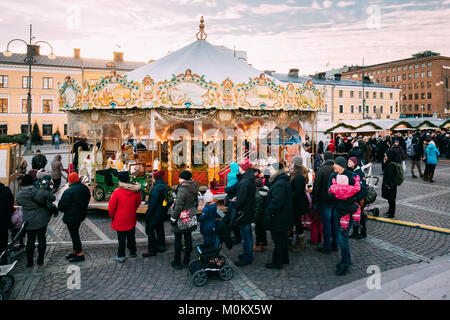 Helsinki, Finland - December 10, 2016: Christmas Holiday Carousel In Senate Square In Winter Day Stock Photo