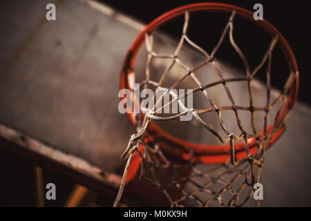 Closeup view of basketball hoop by night. Stock Photo