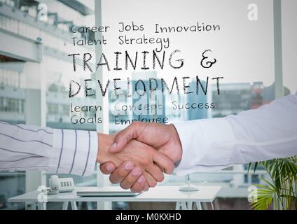 Two men shaking hands in office with plan in text behind them Stock Photo