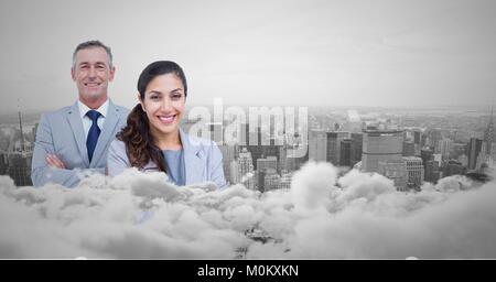 Business man and woman facing out with city skyline behind them and clouds in front Stock Photo