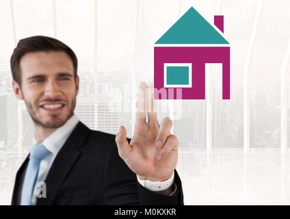 Businessman touching house icon Stock Photo