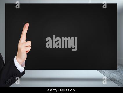Hand pointing over black screen Stock Photo