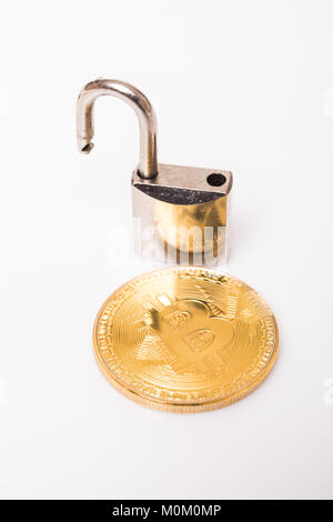 Golden bitcoin with a open lock isolated on white Stock Photo