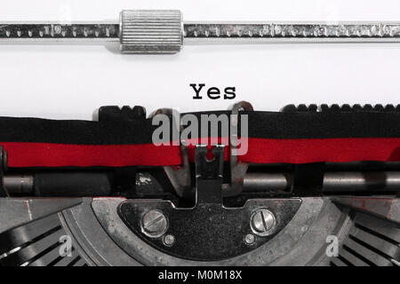 Text YES written with the old typewriter on white sheet Stock Photo