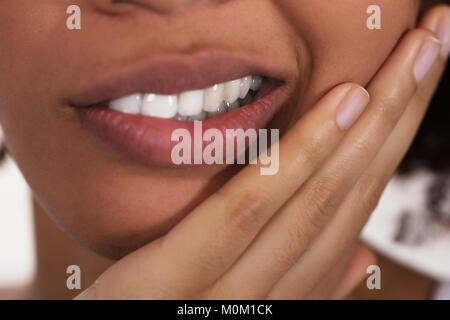 Close-up Of A Woman's Face Having Tooth Pain Stock Photo