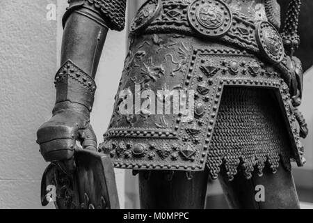 Hand in armour of the medieval knight statue Stock Photo