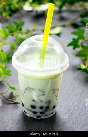 Green matcha bubble tea and black tapioca pearls Stock Photo