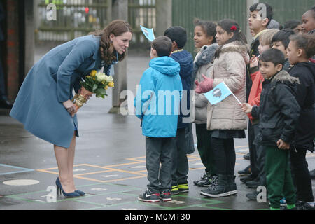 The Duchess of Cambridge greets children as she arrives at Roe Green Junior School in Brent, London where she will launch a mental health programme for schools, in the latest initiative from the Heads Together campaign and meet with pupils and teachers and take part in a lesson designed to help support a child's mental health and well-being. Stock Photo