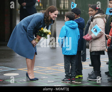The Duchess of Cambridge greets children as she arrives at Roe Green Junior School in Brent, London where she will launch a mental health programme for schools, in the latest initiative from the Heads Together campaign and meet with pupils and teachers and take part in a lesson designed to help support a child's mental health and well-being. Stock Photo