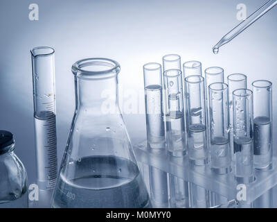 Different laboratory beakers and glassware. Monochrome. Stock Photo