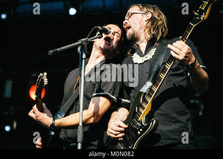 The Berlin-based international garage rock band King Khan and the Shrines performs a live concert at the Polish music festival Off Festival 2015 in Katowice. Here the band’s guitarist and bassist are pictured live on stage. Poland, 08/08 2015. Stock Photo