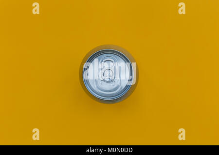 Silver drinks can on bright yellow background Stock Photo