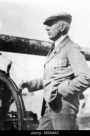 Roald Amundsen. The Norwegian polar explorer Roald Engelbregt Gravning Amundsen (1872-1928) at the wheel of a boat c.1920. Stock Photo