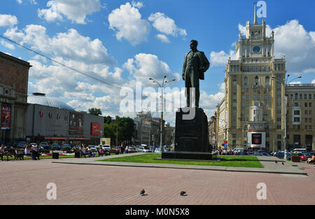 Moscow, Russia - July 04, 2014: People resting at the monument to Vladimir Mayakovsky against the hotel Peking. The hotel was opened in 1956, and ever Stock Photo