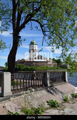 Vyborg, Leningrad oblast, Russia - June 6, 2015: View to the embankment and the tower of St. Olav of Vyborg Castle. The castle was founded in 1293 Stock Photo