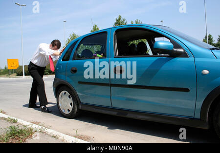 Pushing cars Stock Photo