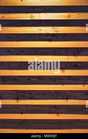 Wooden background from planks. Texture of boards illuminated by artificial light. Stock Photo