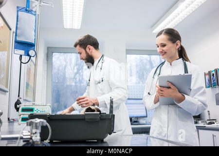 Vet doctors in their clinic with a cat patient Stock Photo