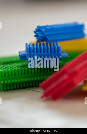 Stickle Bricks -  A still life of a children's plastic construction toy in bright primary colours. Stock Photo