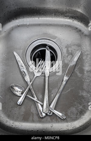 Silverware Knives Fork & Spoon In Sink Stock Photo