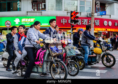 Shanghai, China. Mopeds crowd the streets of Shanghai, China. Credit: Benjamin Ginsberg Stock Photo