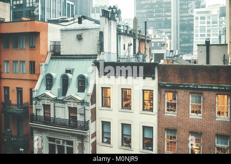 Retro toned picture of old buildings in Midtown Manhattan on a rainy day, New York, USA. Stock Photo
