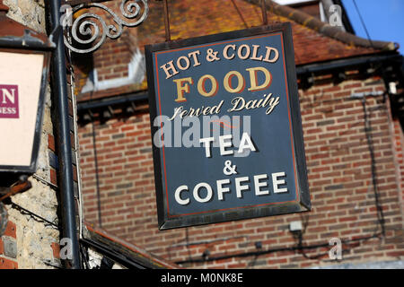 Hot and Cold Food Served Dailey and Tea and Coffee sign pictured outside a building in Selsey, West Sussex, UK. Stock Photo